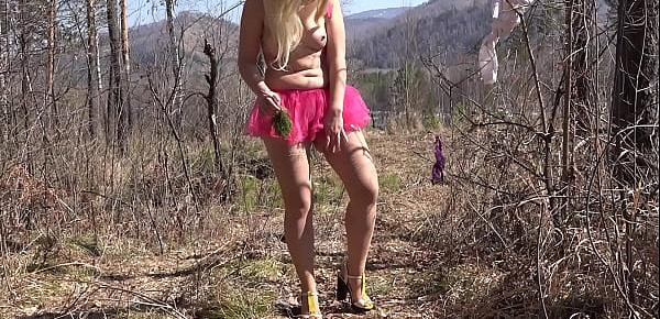  Fusion with nature in the outdoors. Blonde with a big ass strips in the forest and with a bare natural hairy pussy playing with a spruce twig.